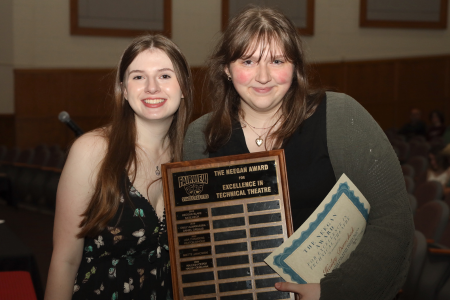  Two FHS students holding awards from Performing Arts Night