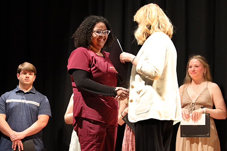  A Fairview High School student is awarded a scholarship at Scholars' Reception on May 11, 2022